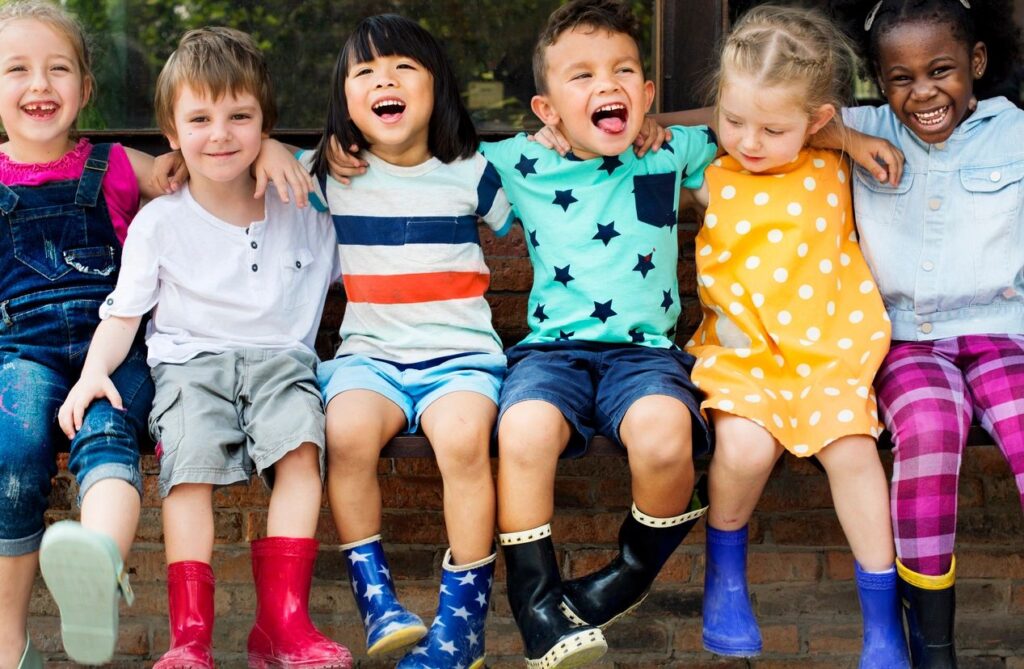 Children sitting and hugging each other